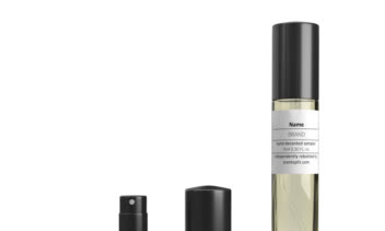 عکاسی تبلیغاتی و چیدمان هنری نمونه‌های عطر لوکس روی سطح سنگی