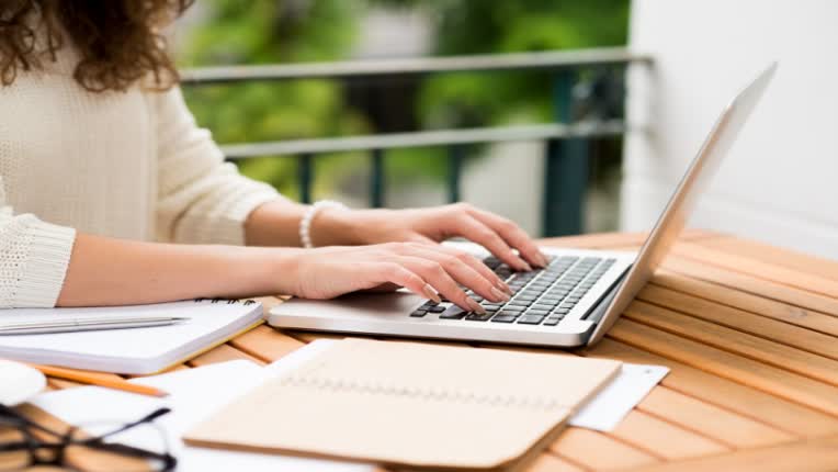 woman_writing_at_laptop.jpg